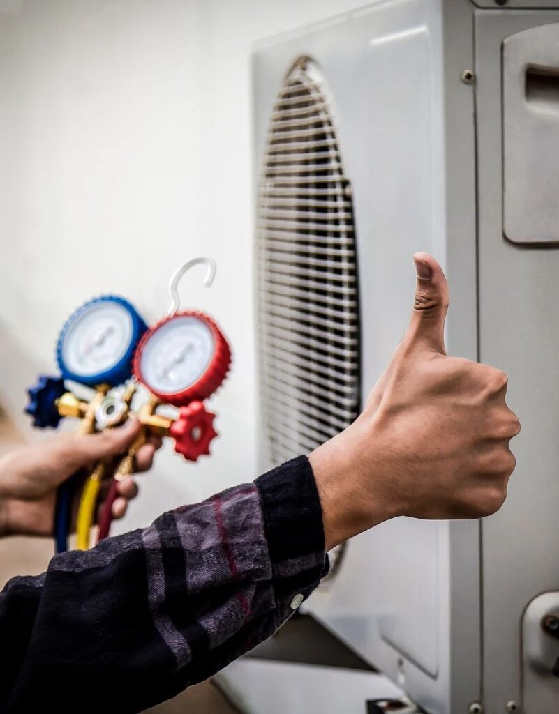 Mastermind Heating and Air Paradise, NV technician diagnosing an AC unit.